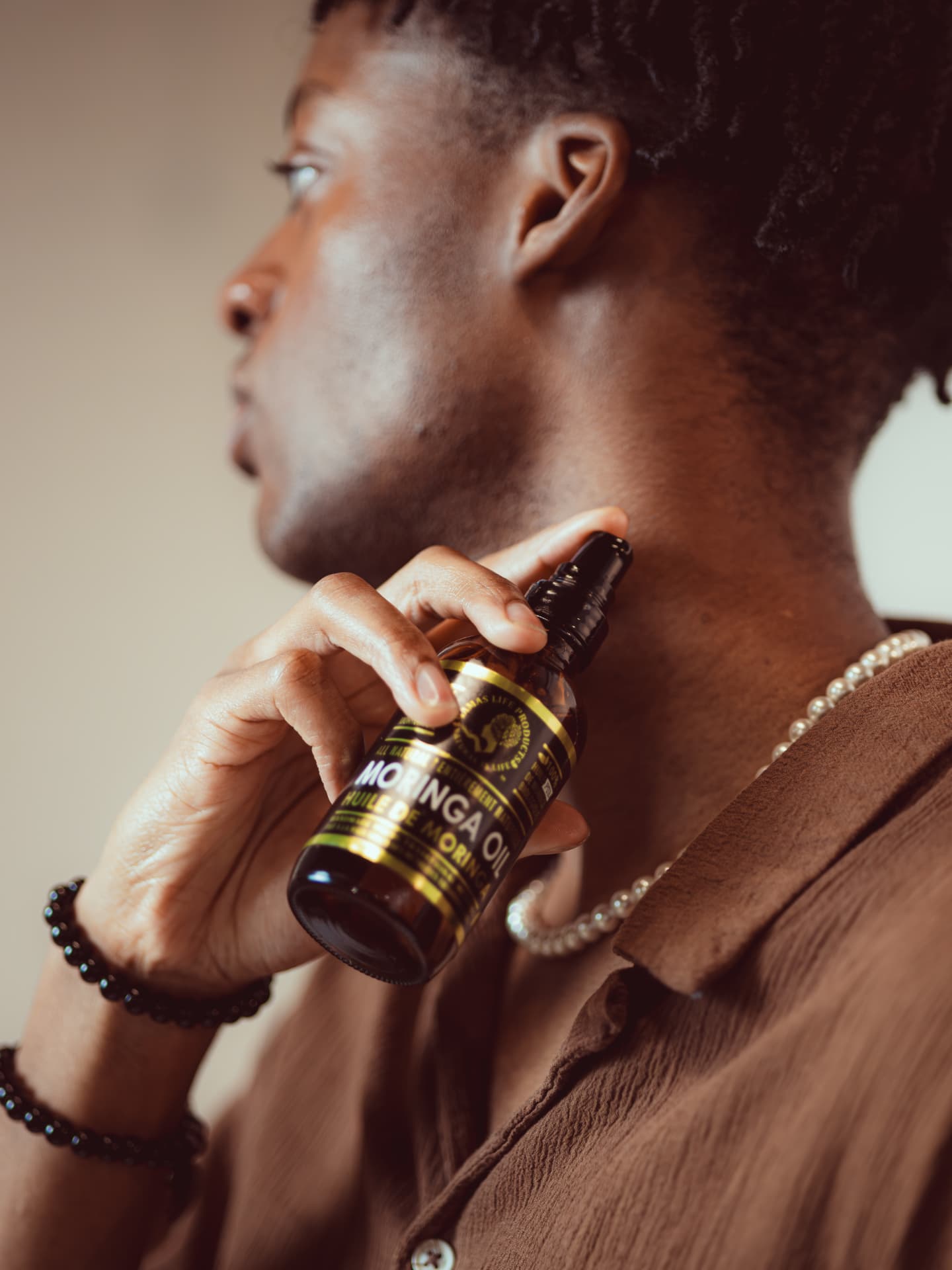 Model applying moringa oil